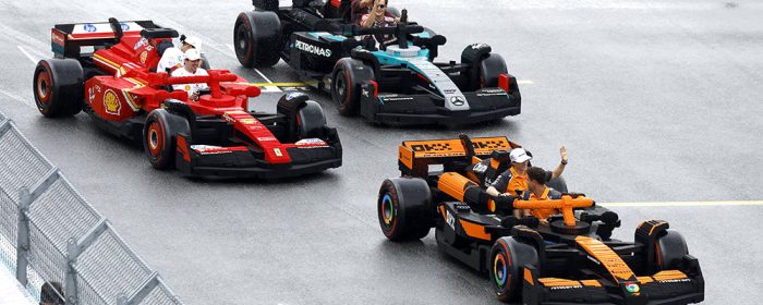 MIAMI, FLORIDA - MAY 04: Charles Leclerc of Monaco and Scuderia Ferrari, Lewis Hamilton of Great Britain and Scuderia Ferrari, George Russell of Great Britain and Mercedes AMG Petronas F1 Team, Andrea Kimi Antonelli of Italy and Mercedes AMG Petronas F1 Team, Lando Norris of Great Britain and McLaren, and Oscar Piastri of Australia and McLaren race LEGO cars on the drivers parade during the F1 Grand Prix of Miami at Miami International Autodrome on May 04, 2025 in Miami, Florida. (Photo by Glenn Dunbar/Getty Images for LEGO Group)