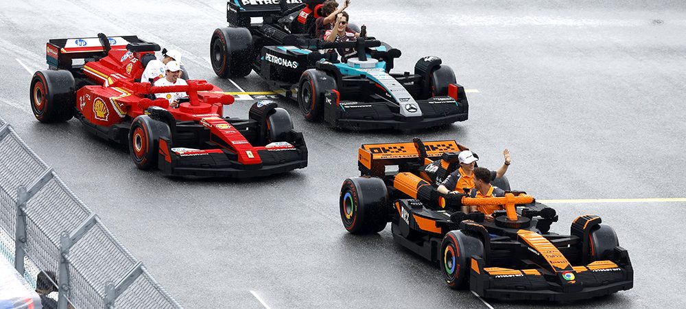 MIAMI, FLORIDA - MAY 04: Charles Leclerc of Monaco and Scuderia Ferrari, Lewis Hamilton of Great Britain and Scuderia Ferrari, George Russell of Great Britain and Mercedes AMG Petronas F1 Team, Andrea Kimi Antonelli of Italy and Mercedes AMG Petronas F1 Team, Lando Norris of Great Britain and McLaren, and Oscar Piastri of Australia and McLaren race LEGO cars on the drivers parade during the F1 Grand Prix of Miami at Miami International Autodrome on May 04, 2025 in Miami, Florida. (Photo by Glenn Dunbar/Getty Images for LEGO Group)