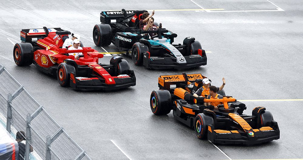 MIAMI, FLORIDA - MAY 04: Charles Leclerc of Monaco and Scuderia Ferrari, Lewis Hamilton of Great Britain and Scuderia Ferrari, George Russell of Great Britain and Mercedes AMG Petronas F1 Team, Andrea Kimi Antonelli of Italy and Mercedes AMG Petronas F1 Team, Lando Norris of Great Britain and McLaren, and Oscar Piastri of Australia and McLaren race LEGO cars on the drivers parade during the F1 Grand Prix of Miami at Miami International Autodrome on May 04, 2025 in Miami, Florida. (Photo by Glenn Dunbar/Getty Images for LEGO Group)